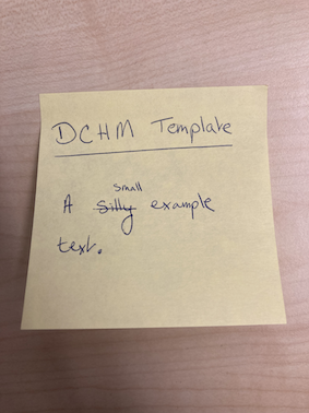 
               A photograph of the front of a post-it with a simple example phrase.
            