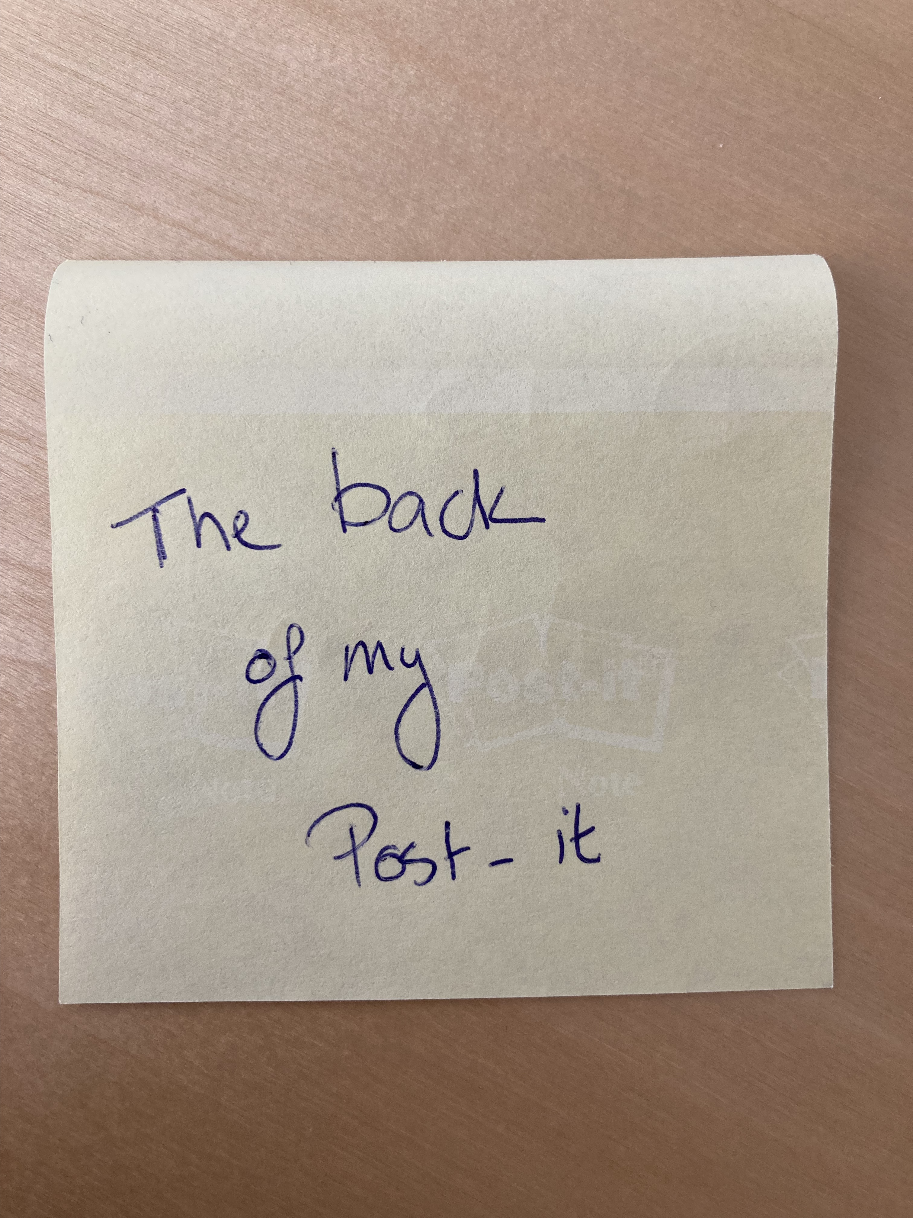 
               A photograph of the back a post-it with a simple example phrase.
            