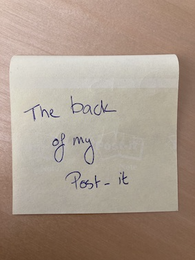 
               A photograph of the back a post-it with a simple example phrase.
            